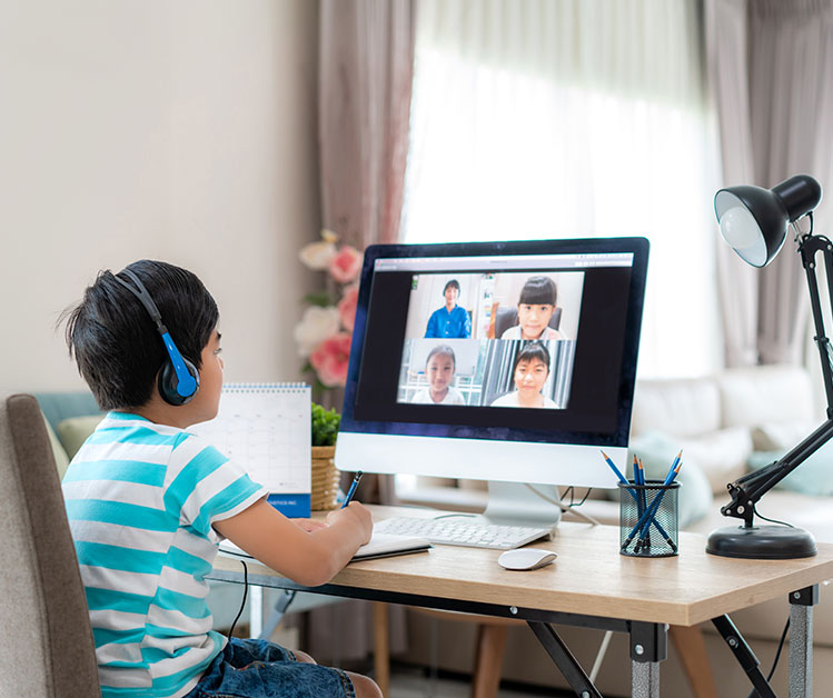 Focused child attending an online class